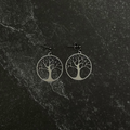 Tree of life earrings on black stone. 