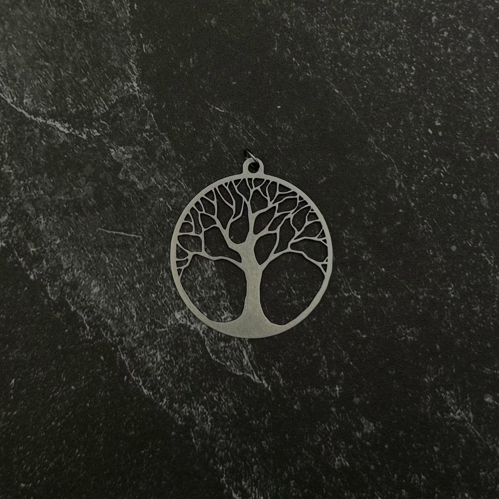 tree of life pendant on a black background