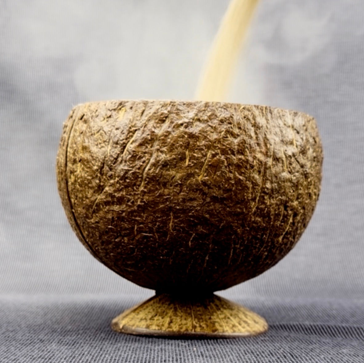 Coconut  bowel with floral arrangement 